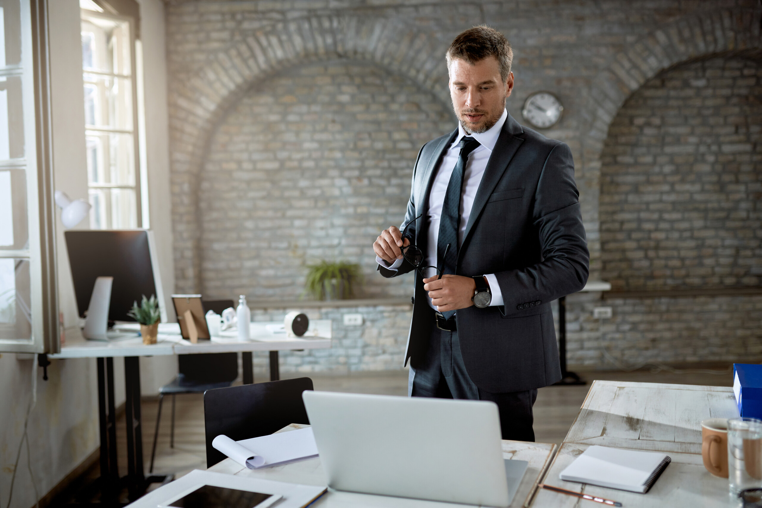 Male entrepreneur working on a computer in the office.